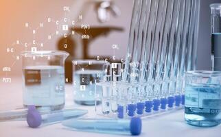 biochemical research scientist working with a microscope for the virus,Doctor man write a history of the experimental results in a , laboratory glassware containing chemical liquid for design. photo