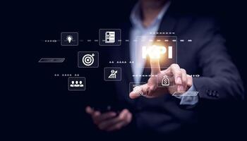 Key Performance Indicator Planning KPI, Company Management Business Internet Technology Concept, Businessman using a laptop with document management, enterprise resource management software system photo