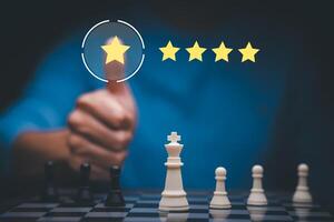 The concept of placing rating. Businessman touching technology on five star excellent rating on blue background, Concept of satisfaction, quality and performance of services.Copy space for web banner. photo