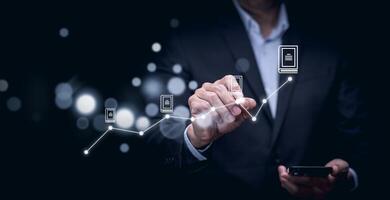 The man is holding magnifying glasses under a concept.Online documentation database, IT consultant being set up Virtual Document Management System with laptop,Software for archiving corporate files. photo