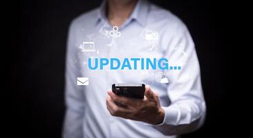 Man holding mobile with Update Software Program Upgrade Business Technology Internet, Update on virtual screen. Internet and technology concept, loading bar with installing the update. photo