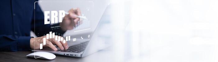 Business people using a laptop with document management for ERP. Enterprise resource planning concept,Enterprise Resource Management ERP software system for business resources plan presented. photo