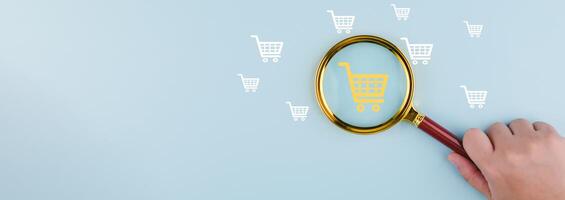 Magnifying glass focus with online shopping concept, marketplace website with virtual interface of online Shopping cart part of the network, Online shopping business with selecting shopping cart. photo