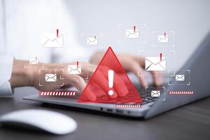Email concept with spam and virus computer monitor internet security concept, businessman reading electronic mail with a laptop. Spam, junk and e-marketing on screen, Spam Email Pop-up Warning. photo