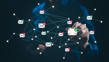 Businessman sending email by laptop computer to customer, business contact and communication, email icon, email marketing concept, send e-mail or newsletter, online working internet network. photo