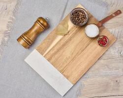 Empty rectangular wooden cutting board on table, top view photo