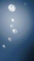 Yellow and blue background. Motion. Light background with small transparent bubbles that burst in cartoon animation. video