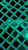 3d cubes move in neon cells. Design. Wave movements of squares in neon cells. 3D squares on surface move in waves with neon light video