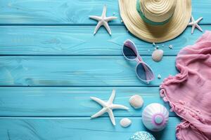 top view beach accessories on blue wooden background with copy space photo