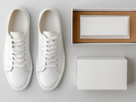 Top view of new white sneakers with minimalist style packaging on a light background. photo