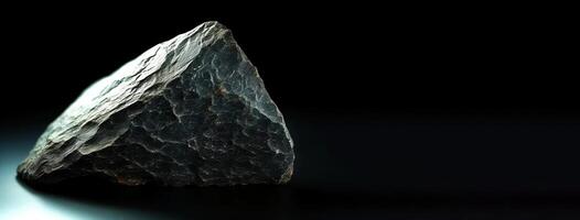 Ottrelite fossil mineral stone. Geological crystalline fossil. Dark background close-up. photo
