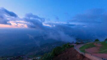 A stunning twilight scene with rolling clouds over mountains, casting a serene, ethereal ambiance. video
