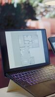 Vertical Entrepreneur planning an office relocation evaluating architectural blueprints, consulting with interior designers to create an inspiring workspace. Hunting for property leasing. Camera B. video
