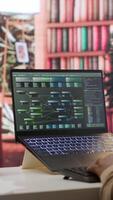 Vertical AI software engineer coding modern innovative development project on his gadgets, showcasing machine learning and data processing on neural network. Artificial intelligence business. Camera A. video
