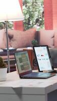 Vertical Empty home office desk filled with documents and business reports on laptop, space used for a person to study the market and work on accountancy. Startup budget balance analysis. video