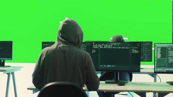 Cyber security experts working with mockup layout on a big screen, using encryption and IT security in a governmental agency. Focusing on cyber operations to hack rival states systems. Camera A. video