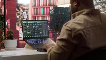 AI software engineer coding modern innovative development project on his gadgets, showcasing machine learning and data processing on neural network. Artificial intelligence business. Camera A. video