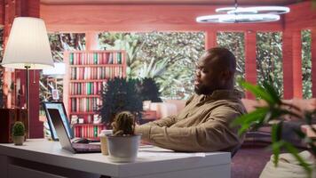 Businessman conducting a videocall meeting online with shareholders, reviewing data analytics and statistics to obtain funds for investment and development strategy. Startup growth. Camera B. video