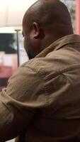 Vertical Startup entrepreneur looking into project details on laptop at his home setup, reviewing budget numbers and solving business tasks to achieve enterprise growth objectives. Camera A. video