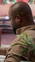 Vertical Financial manager taking notes for a new funding strategy, calculating profit and expenses at home desk. Working to increase business profit, accounting specialist evaluating market trends. Camera A. video