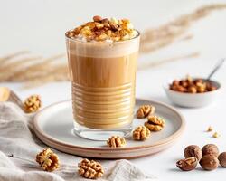 Nutella latte with walnuts and hazelnuts on a white plate photo