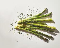 asparagus with sesame seeds on white background photo
