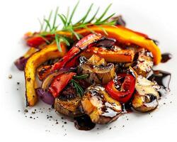 a plate of vegetables with a sprig of rosemary photo