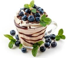 milk shake with blueberries and mint leaves isolated on white background photo