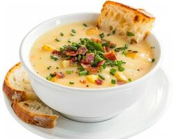 a bowl of soup with bacon and bread on a white plate photo