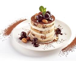 a dessert with chocolate and nuts on a white plate photo