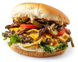 a large hamburger with cheese, pickles, and tomatoes photo