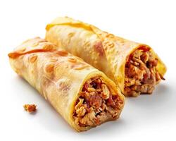 two chicken and cheese wraps on a white surface photo