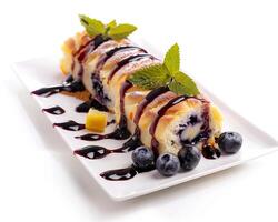 a white plate topped with a dessert with blueberries photo