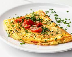 slice of omelet with tomatoes and herbs photo