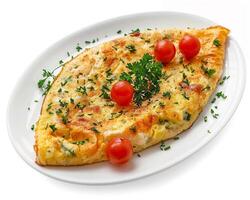 plate with cheesy omelet on it photo