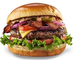 a large hamburger with bacon, lettuce, tomatoes and onions photo