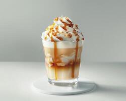 a glass of iced coffee with whipped cream and caramel photo