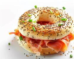 a bagel with meat and cheese on it photo