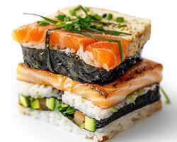 a stack of sushi with salmon, avocado, and cucumber photo
