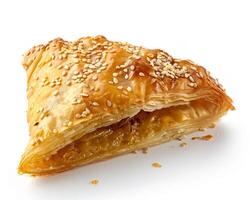 a piece of pastry with sesame seeds on it photo