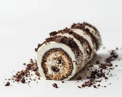 a chocolate roll with cream and chocolate chips photo