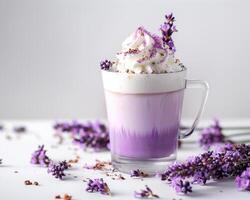 lavender coffee with whipped cream and lavender flowers on white background photo