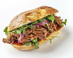 a sandwich with meat and vegetables on a white surface photo