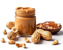 peanut butter and peanut butter spread on a white background photo