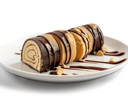 a chocolate roll with peanut butter drizzle on it photo