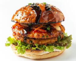 a hamburger with ketchup and lettuce on a white background photo