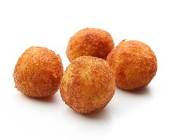 four fried balls of dough on a white background photo