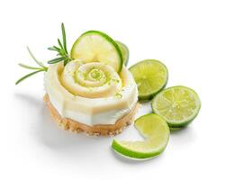 a slice of cheesecake with lime slices and rosemary photo