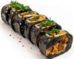 a sushi roll with vegetables and herbs on it photo