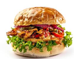 a large sandwich with lettuce and meat on a white background photo